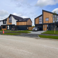 Housing development fitted with steel cladding on each house